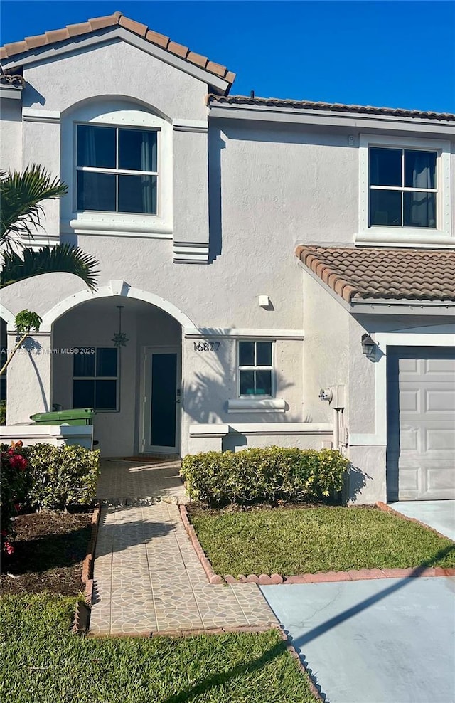 view of front of property with a garage