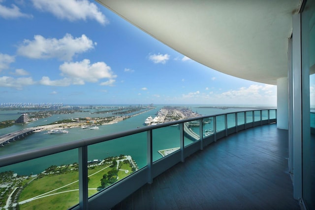 balcony featuring a water view