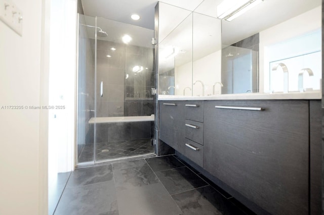 bathroom featuring vanity and an enclosed shower