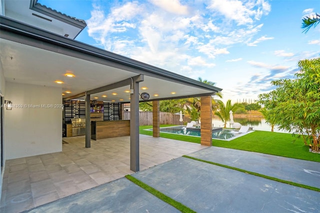 view of patio / terrace featuring a water view