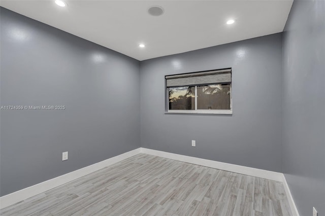 unfurnished room with light hardwood / wood-style flooring