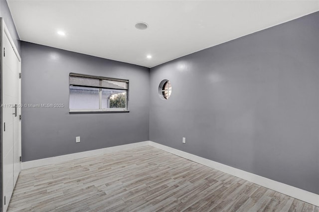 empty room with light wood-type flooring