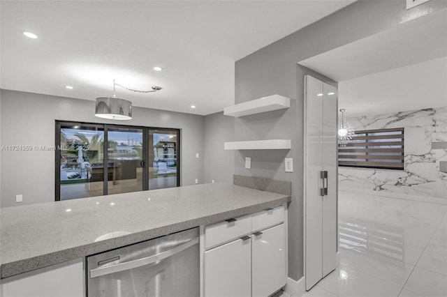 kitchen featuring pendant lighting, dishwasher, light stone counters, and white cabinetry