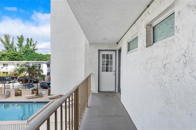 entrance to property featuring a balcony