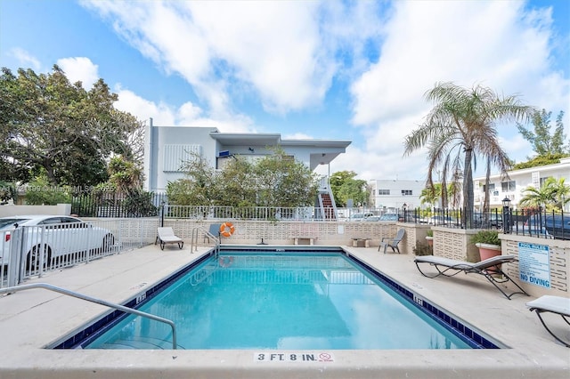 view of swimming pool featuring a patio area