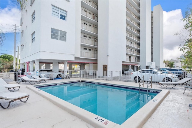 view of swimming pool featuring a patio area