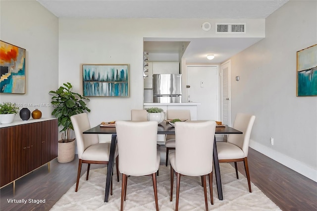 dining area with hardwood / wood-style flooring