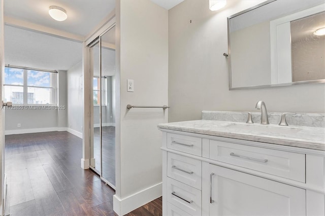 2450 NE 135th St Unit 406, North Miami, FL 33181 - bathroom featuring wood finished floors and vanity