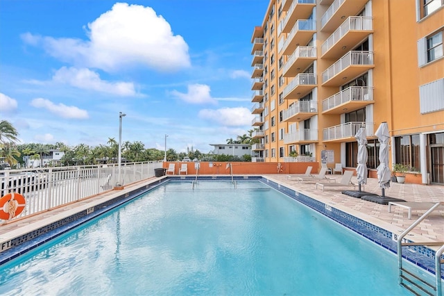 view of swimming pool featuring a patio