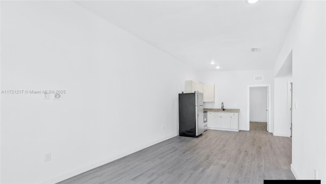 interior space with light hardwood / wood-style flooring