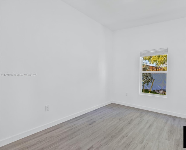 empty room with light wood-type flooring