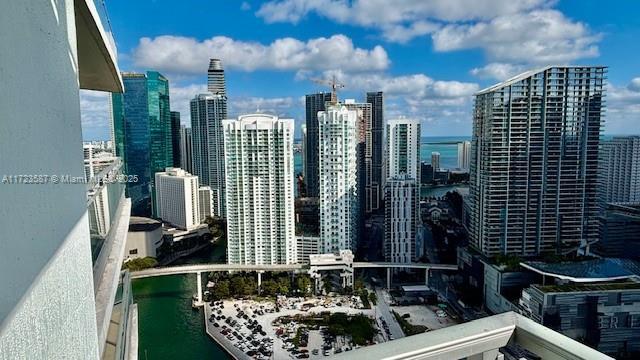 property's view of city featuring a water view