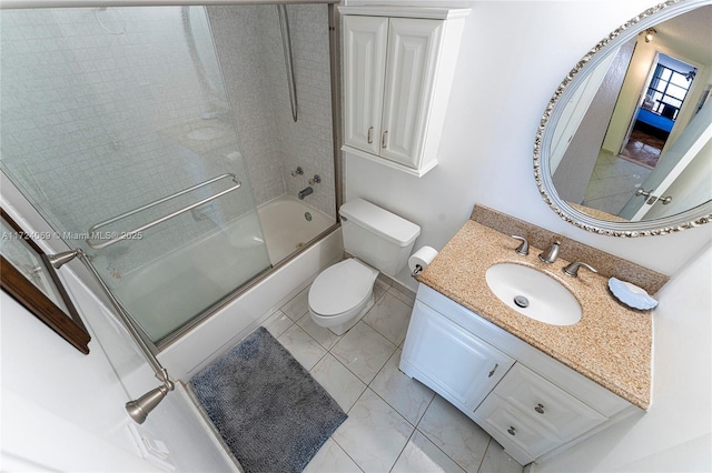 full bathroom with vanity, shower / bath combination with glass door, tile patterned floors, and toilet