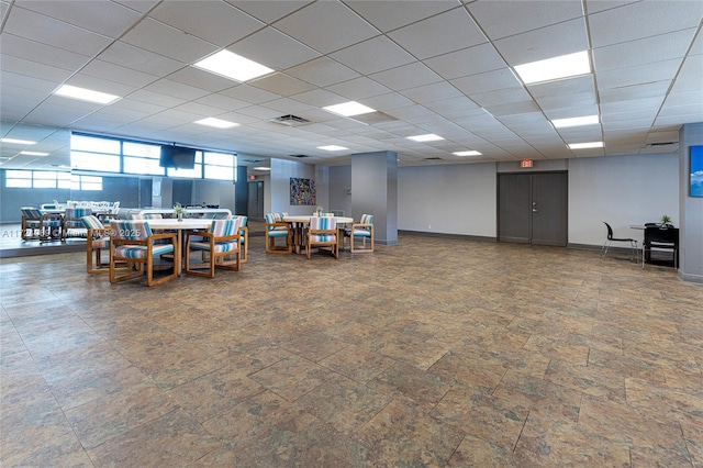 interior space featuring a drop ceiling