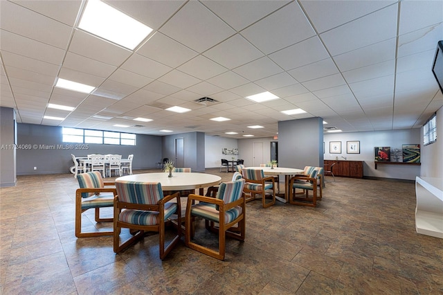 dining space featuring a paneled ceiling