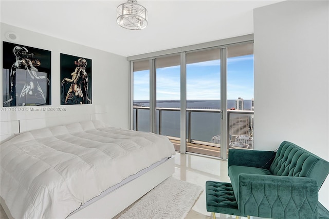 bedroom featuring expansive windows