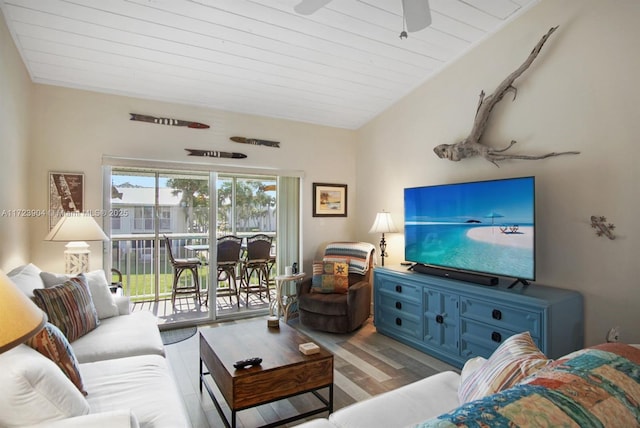 living area with ceiling fan and wood finished floors