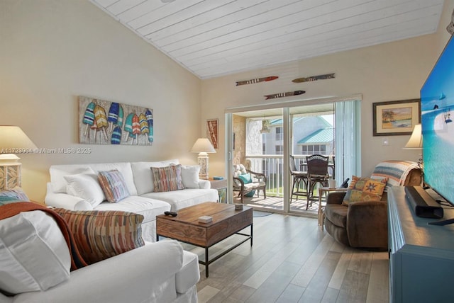 living room with lofted ceiling, wood ceiling, and wood finished floors