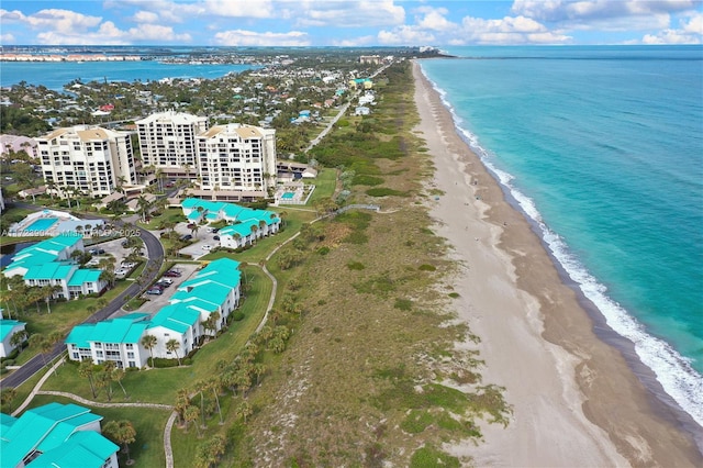 bird's eye view with a water view and a view of the beach