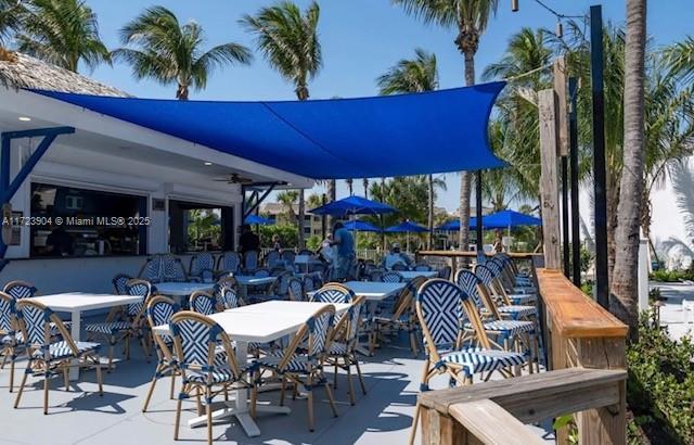 view of patio / terrace with outdoor dry bar and outdoor dining area