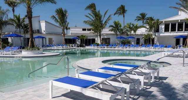 pool with a community hot tub and a patio area