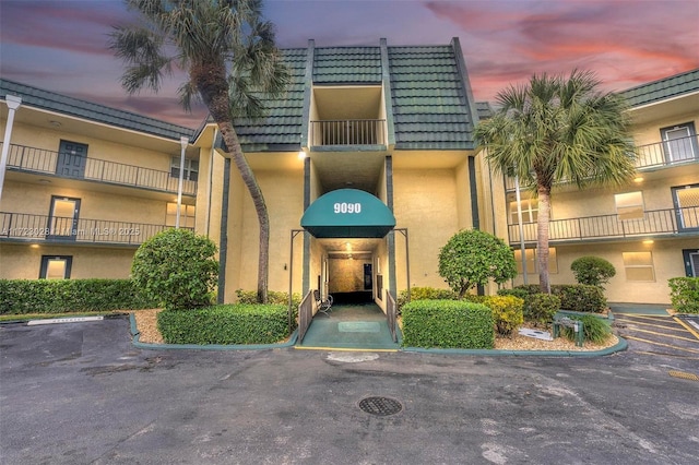 view of outdoor building at dusk