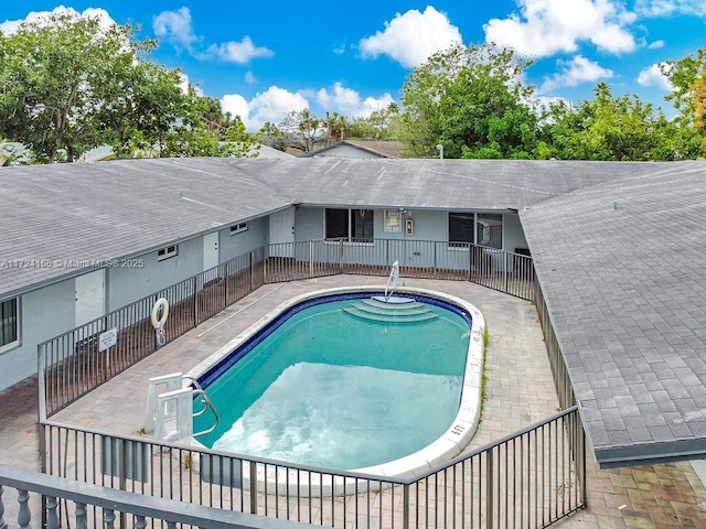 view of swimming pool with a patio