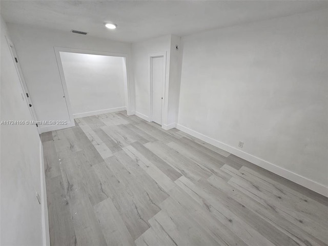 empty room with light wood-type flooring