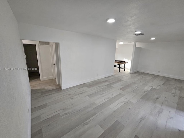 spare room featuring light wood-type flooring