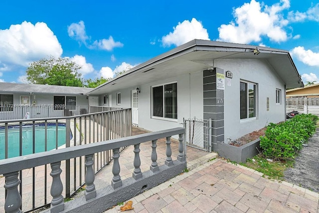 back of property with a patio area