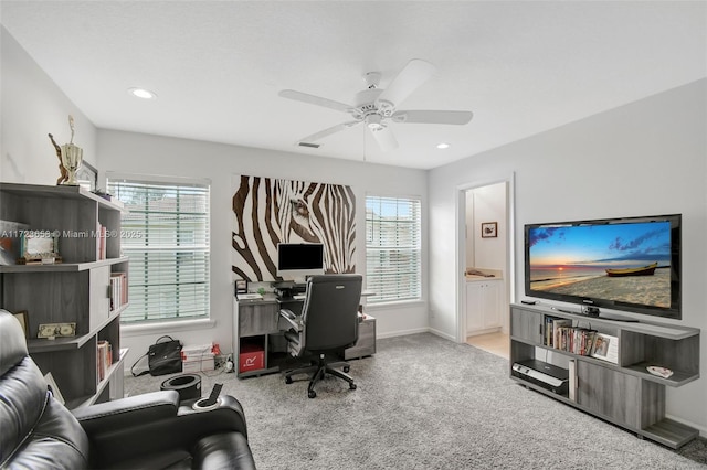 office space with ceiling fan and light colored carpet