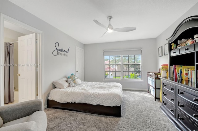 carpeted bedroom featuring ceiling fan