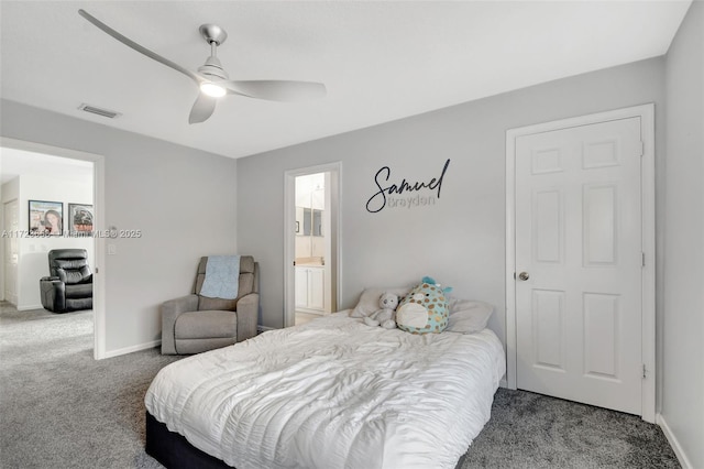 carpeted bedroom with ceiling fan and ensuite bathroom