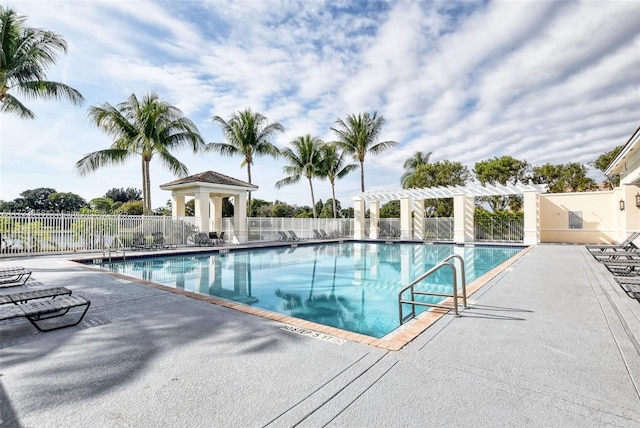 view of pool with a pergola and a patio area