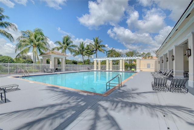 view of pool featuring a pergola and a patio