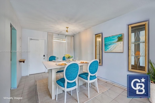 dining area featuring light tile patterned floors