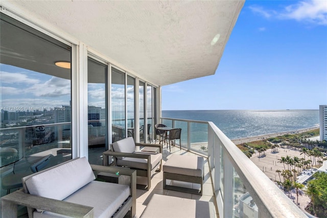 balcony featuring a water view