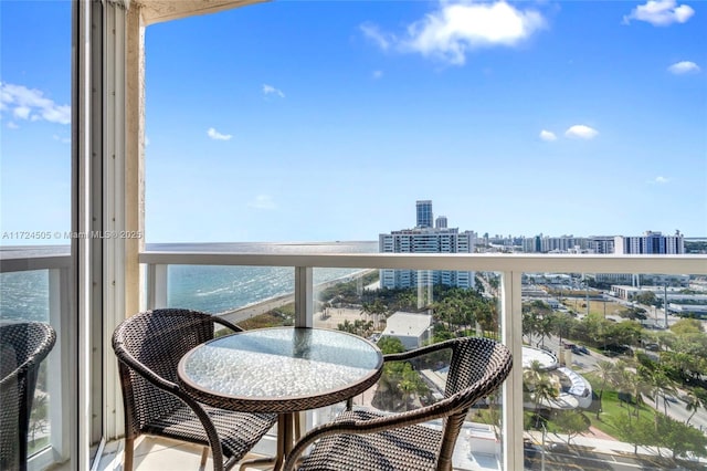 balcony featuring a water view and a view of city