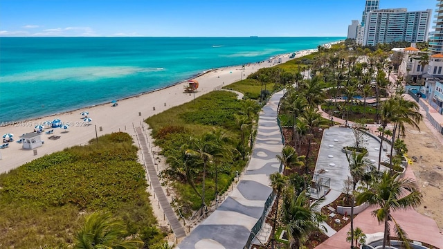 aerial view with a view of the beach and a water view