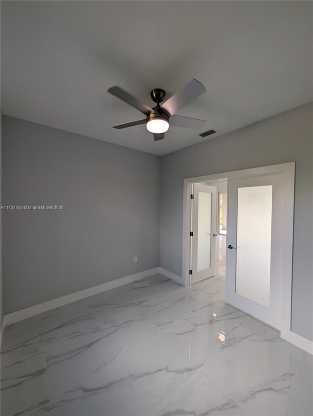 empty room featuring ceiling fan