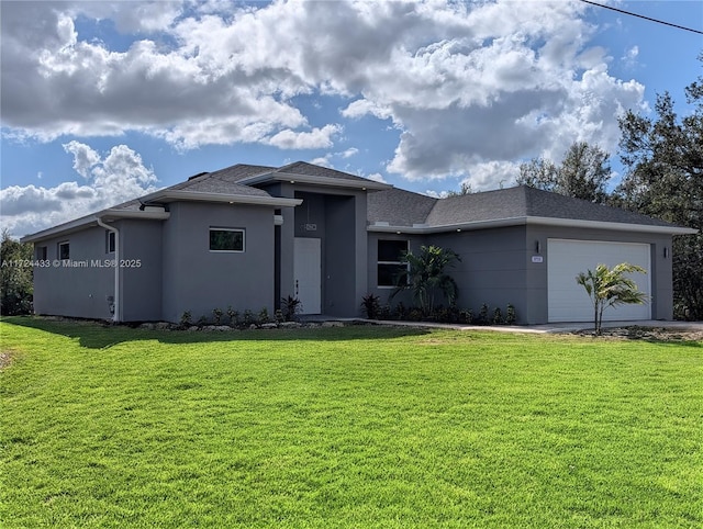 view of front of house featuring a garage and a front yard