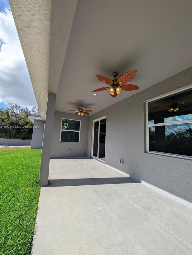 view of patio / terrace featuring ceiling fan