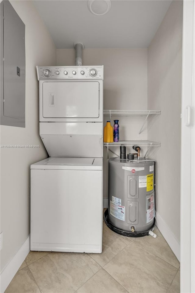 laundry area featuring light tile patterned floors, electric panel, stacked washing maching and dryer, and electric water heater