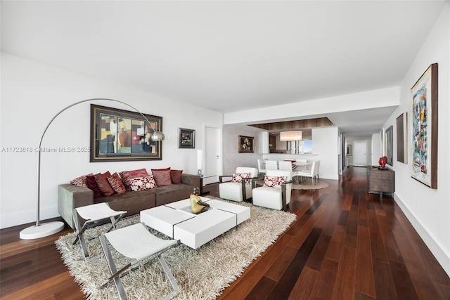 living room with baseboard heating and hardwood / wood-style floors