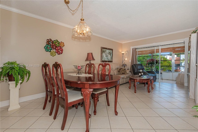 tiled dining space with a textured ceiling, crown molding, and a chandelier