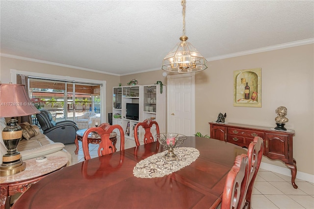 tiled dining space with crown molding, a textured ceiling, and an inviting chandelier