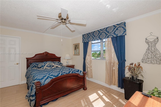 bedroom with ceiling fan, crown molding, and a textured ceiling