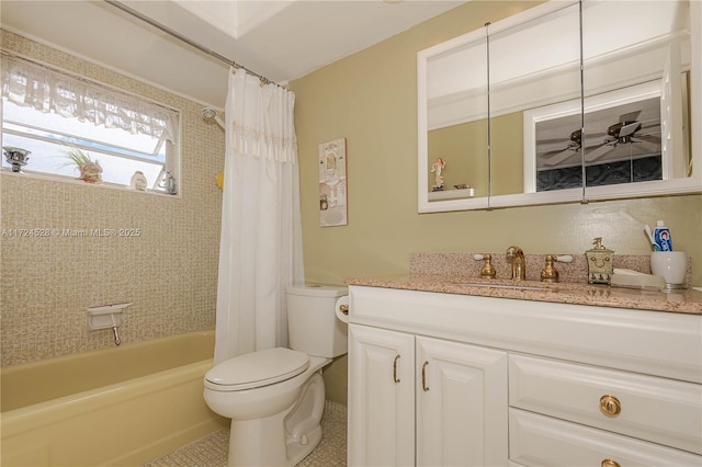 full bathroom featuring shower / bath combo, vanity, tile patterned flooring, ceiling fan, and toilet