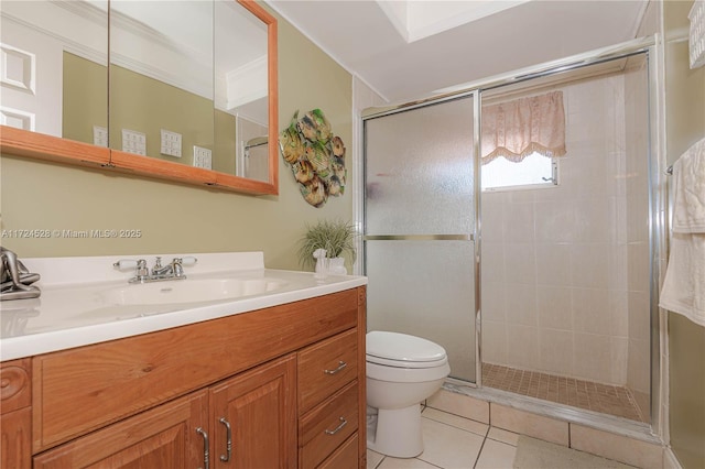 bathroom with walk in shower, tile patterned flooring, toilet, vanity, and ornamental molding