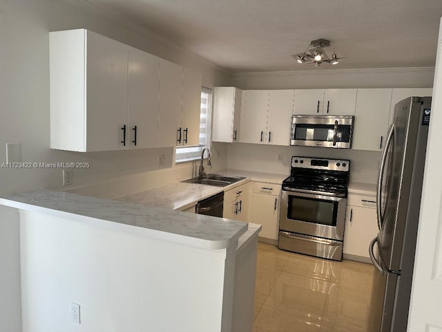 kitchen with white cabinets, sink, light tile patterned flooring, kitchen peninsula, and stainless steel appliances